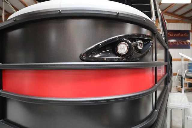Slide: The Image of 2025 Bentley Pontoons Legacy 243 Swingback Ext. Triple Tube, sleek black and red design. - 41