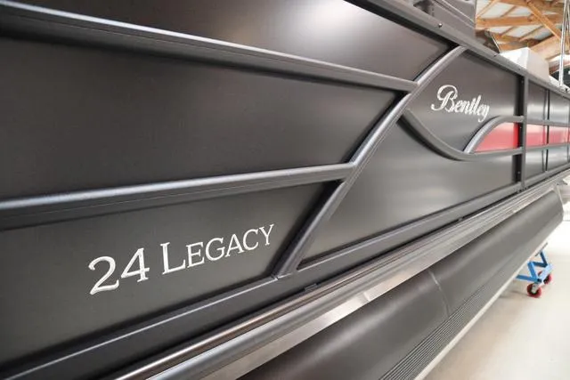 Slide: The Image of 2025 Bentley Pontoons Legacy 243 Swingback Ext. Triple Tube, sleek black exterior design. - 42