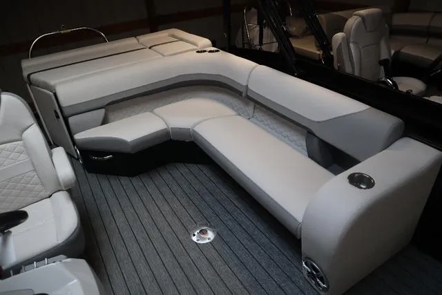 Slide: The Image of 2023 Lowe SS 210 Triple Tube Package interior with plush seating and modern design. - 2