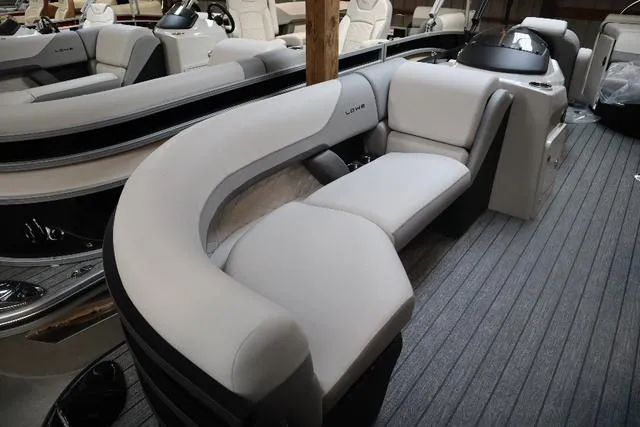 Slide: The Image of 2023 Lowe SS 210 Triple Tube Package boat interior with plush seating and modern design. - 5