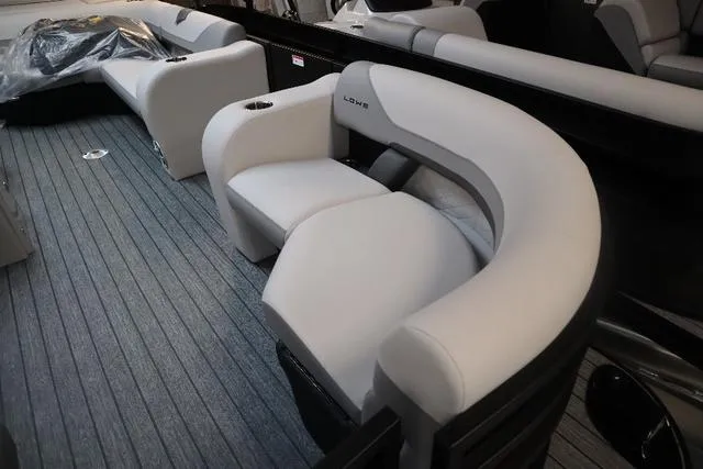 Slide: The Image of 2023 Lowe SS 210 Triple Tube Package interior with plush seating and modern design. - 8