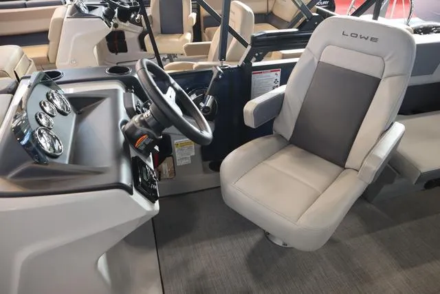 Slide: The Image of Captain's seat and helm of 2025 Lowe LS 230 WT Triple Tube Package boat. - 10