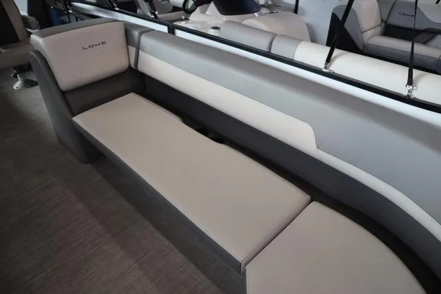 Slide: The Image of 2025 Lowe LS 230 WT Triple Tube Package boat interior with sleek seating design. - 11