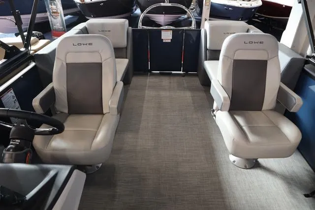 Slide: The Image of Interior of 2025 Lowe LS 230 WT Triple Tube Package boat with plush seating. - 9