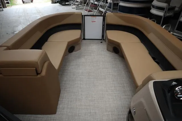 Slide: The Image of 2025 Lowe LS 210 WT boat interior with tan seating and modern design. - 7