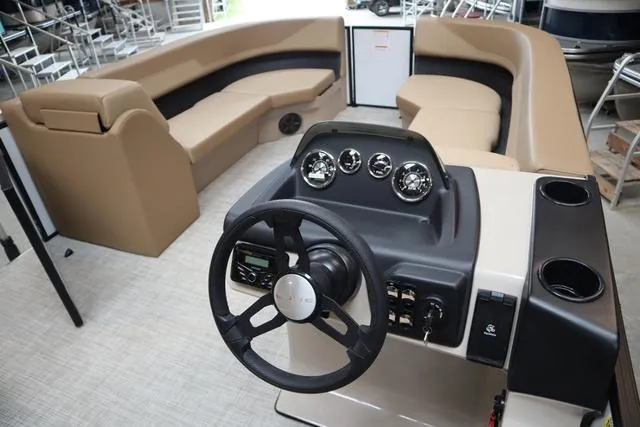 Slide: The Image of Interior of 2025 Lowe LS 210 WT boat with steering console and seating. - 8