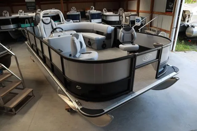 Slide: The Image of 2024 Bentley Pontoons Fish 200 4-Point in showroom, featuring spacious seating and modern design. - 1