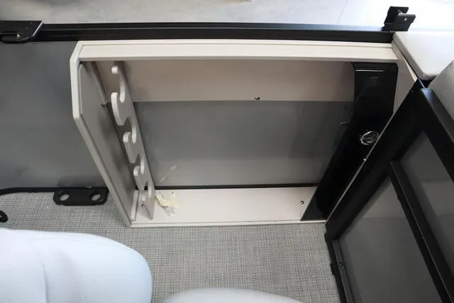 Slide: The Image of 2024 Bentley Pontoons Fish 200 4-Point storage compartment with rod holders, gray interior. - 11