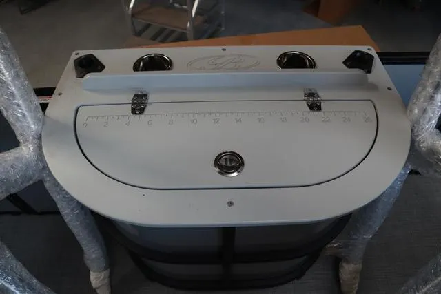 Slide: The Image of 2024 Bentley Pontoons Fish 200 4-Point fishing station with measuring scale and cup holders. - 13