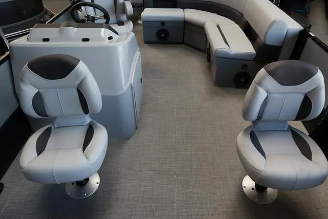 Slide: The Image of 2024 Bentley Pontoons Fish 200 4-Point interior with modern seating and steering console. - 16