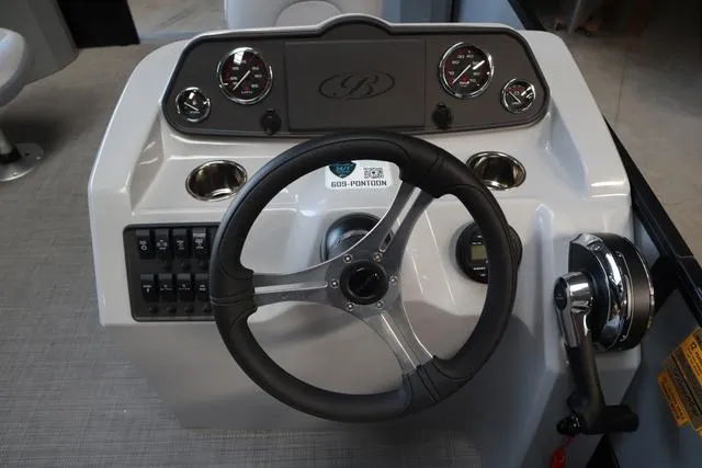 Slide: The Image of 2024 Bentley Pontoons Fish 200 4-Point dashboard with steering wheel and controls. - 25