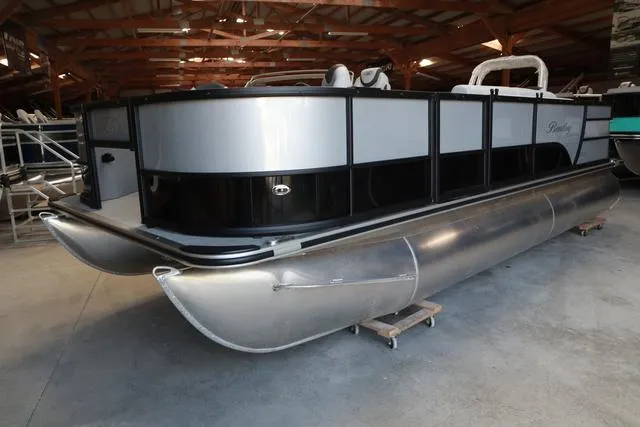 Slide: The Image of 2024 Bentley Pontoons Fish 200 4-Point in a showroom, showcasing sleek design and modern features. - 27