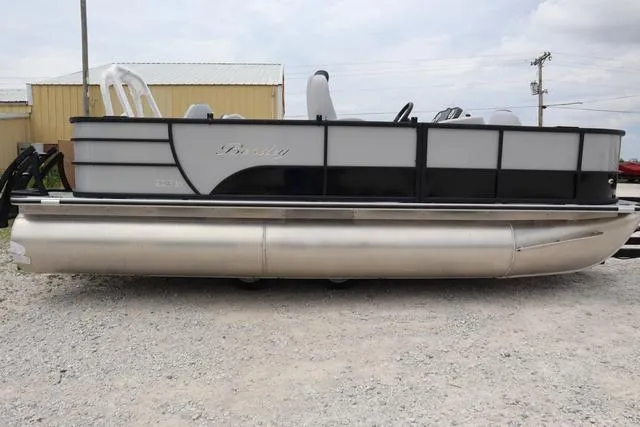 Slide: The Image of 2024 Bentley Pontoons Fish 200 4-Point pontoon boat on gravel lot. - 29