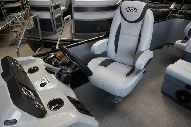 Slide: The Image of 2024 Bentley Pontoons Fish 200 4-Point interior with captain's chair and control panel. - 6