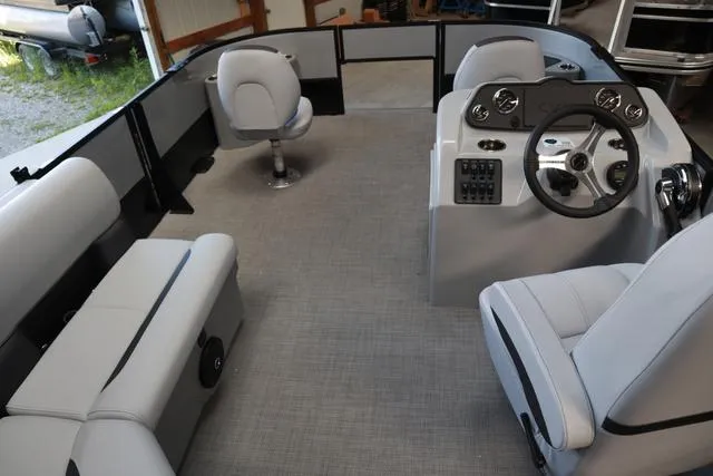 Slide: The Image of 2024 Bentley Pontoons Fish 200 4-Point interior with seating and steering console. - 8