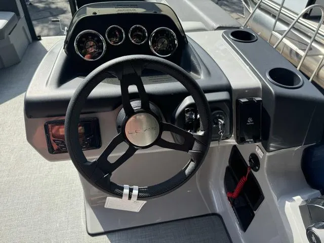 Slide: The Image of Steering console of 2025 Lowe LS 190 boat with gauges and controls. - 7