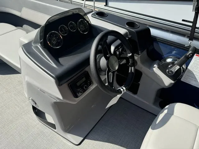 Slide: The Image of 2025 Lowe LS 190 boat dashboard with steering wheel and gauges. - 8
