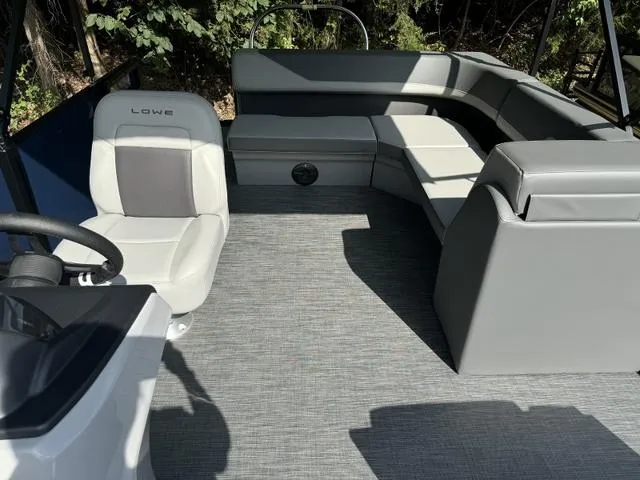 Slide: The Image of Interior of 2025 Lowe LS 190 boat with gray seating and steering wheel. - 9