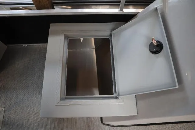 Slide: The Image of Open storage compartment on 2023 Lowe Ultra Fish 182 boat. - 5