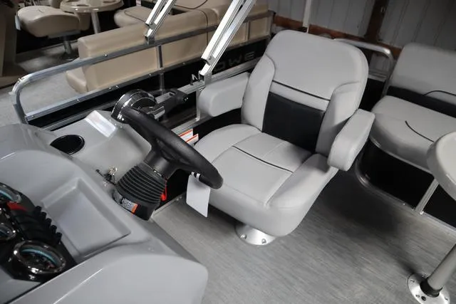 Slide: The Image of Captain's seat of 2023 Lowe Ultra Fish 182 boat with steering wheel and controls. - 7