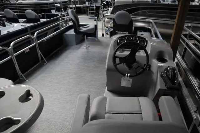 Slide: The Image of 2023 Lowe Ultra Fish 182 boat interior with steering console and seating. - 8