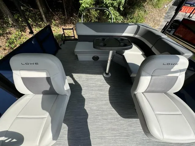Slide: The Image of Interior of 2025 Lowe LS 190 boat with seating and table. - 4
