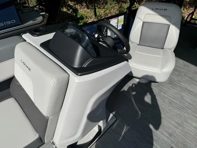 Slide: The Image of 2025 Lowe LS 190 boat interior with steering console and seating. - 5