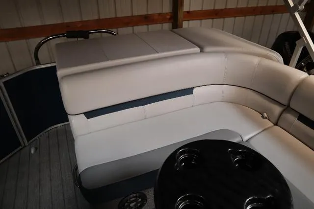 Slide: The Image of 2023 Godfrey Sweetwater 2286 Cruise boat interior with cushioned seating and cup holders. - 5