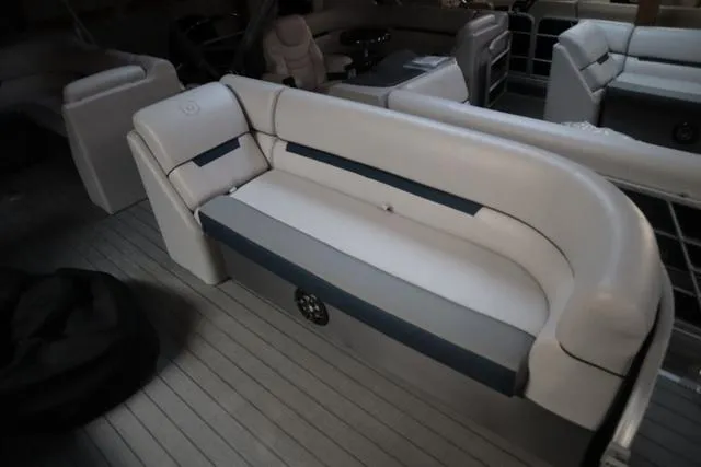 Slide: The Image of 2023 Godfrey Sweetwater 2286 Cruise boat interior with plush seating and modern design. - 6