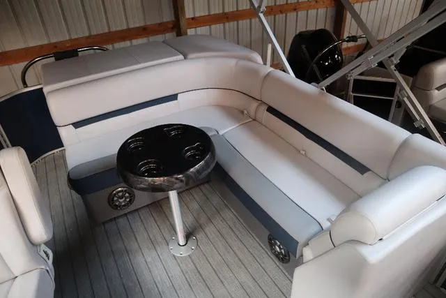 Slide: The Image of 2023 Godfrey Sweetwater 2286 Cruise interior with cushioned seating and table. - 8