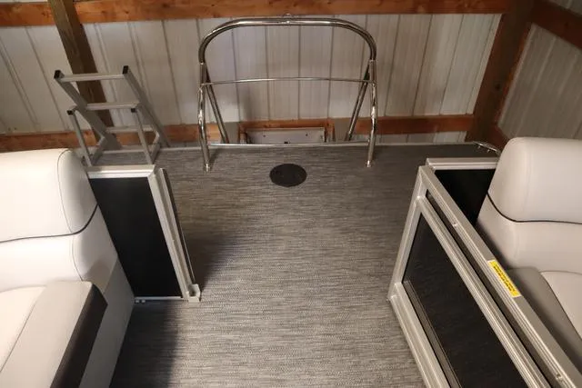 Slide: The Image of 2024 Godfrey Sweetwater 2286 SB Triple Tube Back Porch interior with seating and ladder. - 12