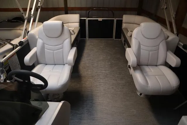 Slide: The Image of 2024 Godfrey Sweetwater 2286 SB boat interior with plush seating and modern design. - 13