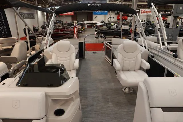 Slide: The Image of 2024 Godfrey Sweetwater 2286 SB Triple Tube pontoon boat interior with plush seating. - 5