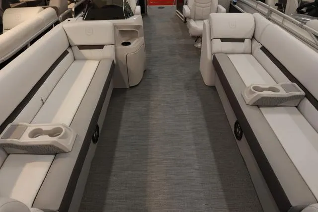 Slide: The Image of 2024 Godfrey Sweetwater 2286 SB boat interior with plush seating and cup holders. - 8