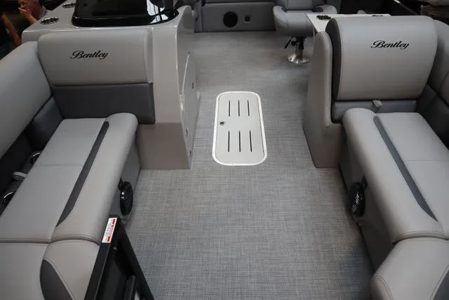 Slide: The Image of 2025 Bentley Pontoons Legacy 223 Swingback interior with gray seating and flooring. - 10