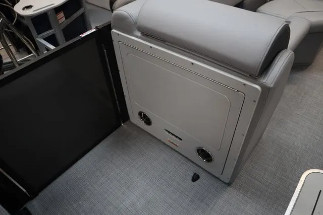 Slide: The Image of 2025 Bentley Pontoons Legacy 223 interior seating with storage compartment and speakers. - 11