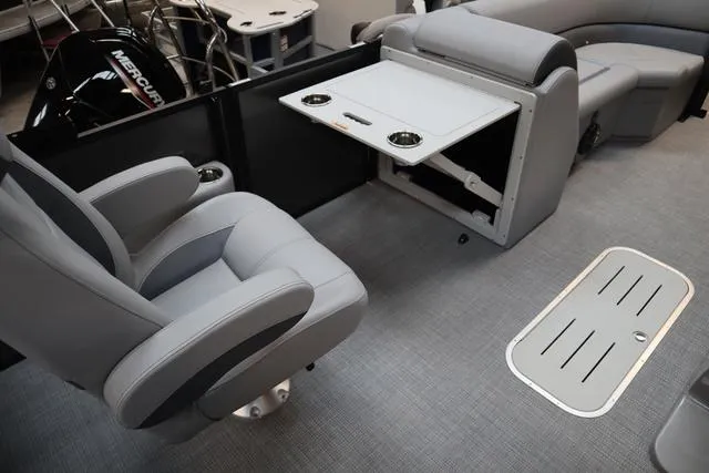 Slide: The Image of 2025 Bentley Pontoons Legacy 223 interior with seating and table setup. - 12