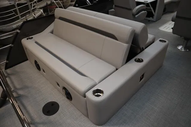 Slide: The Image of 2025 Bentley Pontoons Legacy 223 Swingback interior seating with cup holders and modern design. - 16