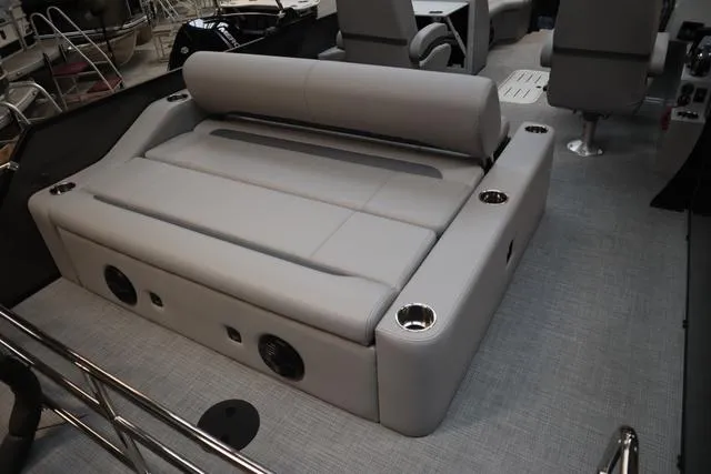 Slide: The Image of 2025 Bentley Pontoons Legacy 223 Swingback interior with plush seating and cup holders. - 17