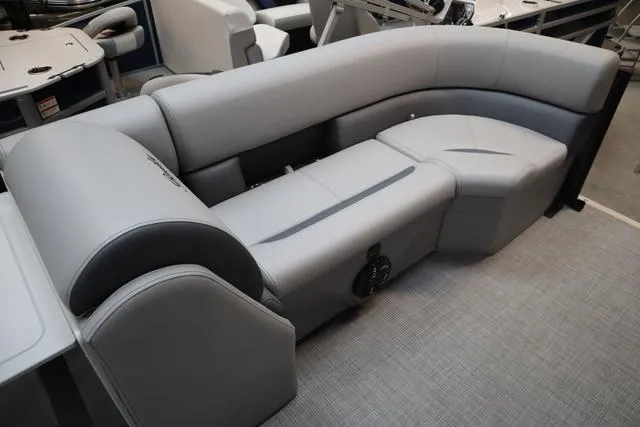 Slide: The Image of 2025 Bentley Pontoons Legacy 223 Swingback interior with gray seating and modern design. - 18