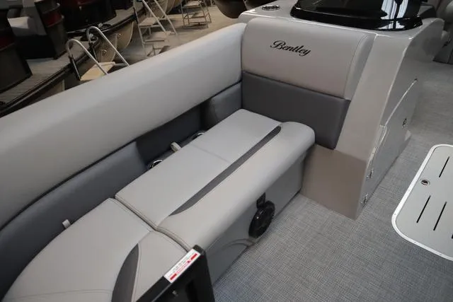Slide: The Image of 2025 Bentley Pontoons Legacy 223 Swingback interior with gray seating and sleek design. - 19