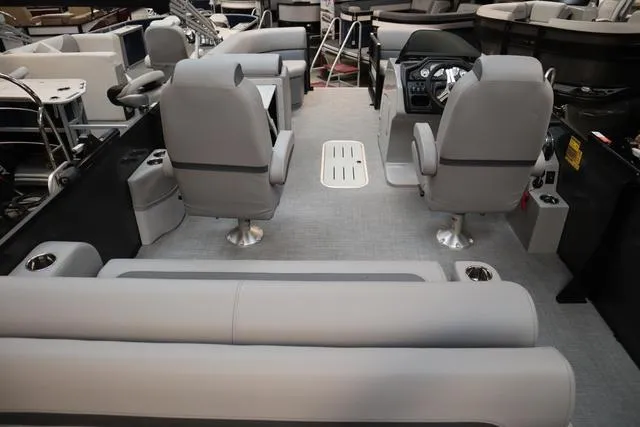 Slide: The Image of 2025 Bentley Pontoons Legacy 223 Swingback interior with gray seating and modern dashboard. - 20