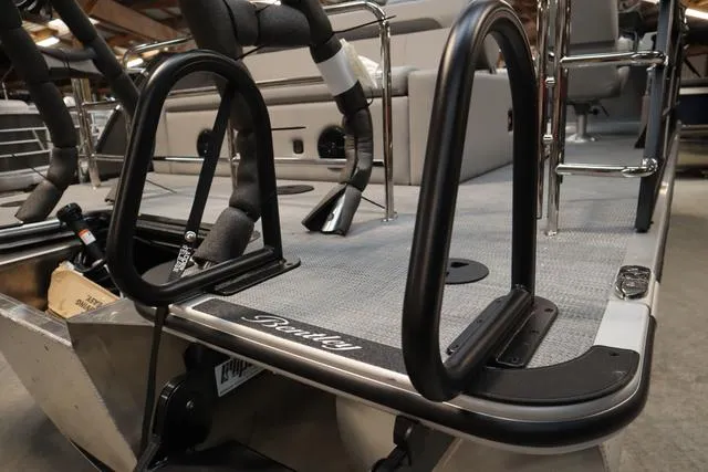 Slide: The Image of 2025 Bentley Pontoons Legacy 223 Swingback Triple Tube, interior view with seating and railings. - 23