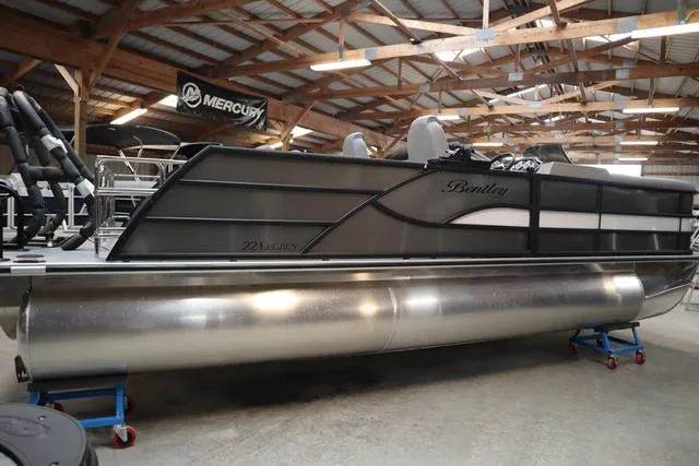 Slide: The Image of 2025 Bentley Pontoons Legacy 223 Swingback Triple Tube in a showroom. - 25