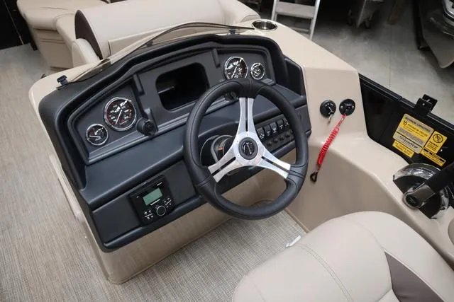 Slide: The Image of 2024 Bentley Pontoons Legacy 220 Navigator interior with luxurious seating and modern design. - 10