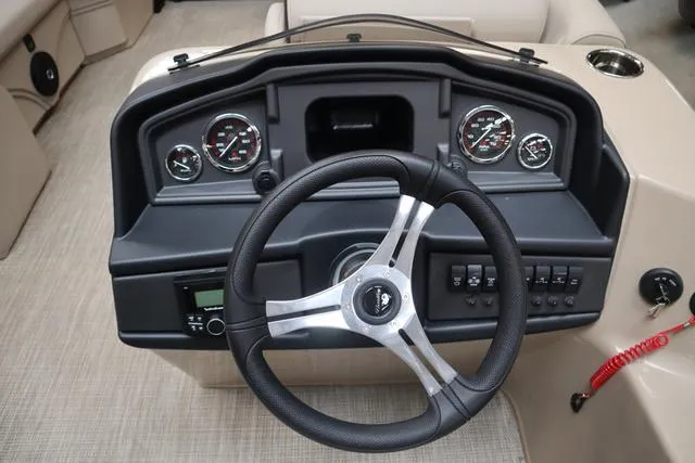 Slide: The Image of 2024 Bentley Pontoons Legacy 220 Navigator interior with luxurious seating and modern dashboard. - 11