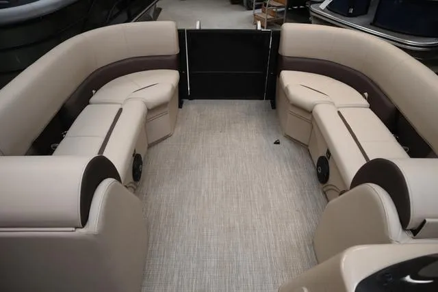 Slide: The Image of 2024 Bentley Pontoons Legacy 220 Navigator interior seating, featuring luxurious white and gray upholstery. - 12