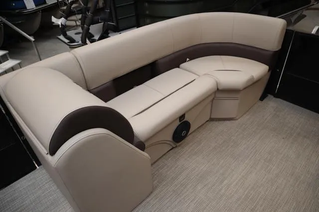 Slide: The Image of 2024 Bentley Pontoons Legacy 220 Navigator interior with luxurious seating and modern design. - 13