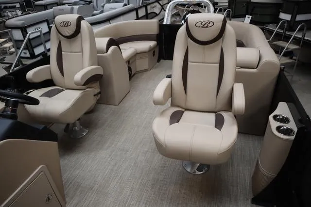 Slide: The Image of 2024 Bentley Pontoons Legacy 220 Navigator interior with luxurious seating and modern design. - 18