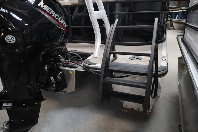Slide: The Image of 2024 Bentley Pontoons Legacy 220 Navigator with Mercury outboard motor and boarding ladder. - 20